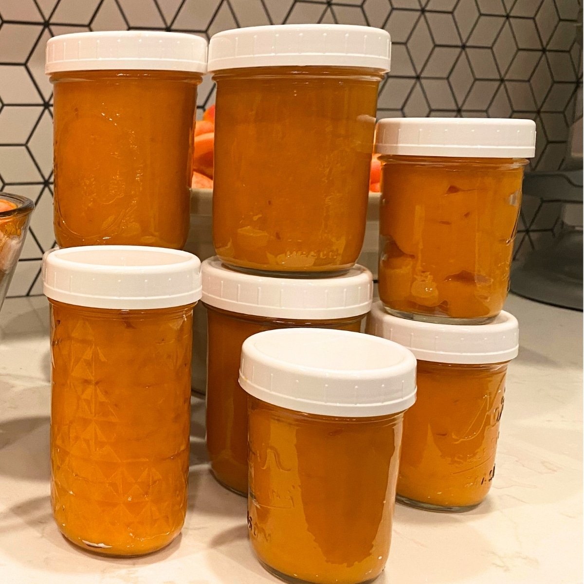 apricot freezer jam in freezer safe jars with plastic lids
