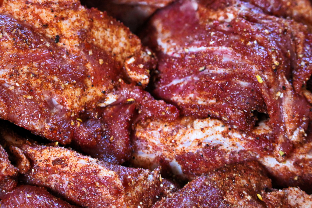 country style pork ribs with dry rub seasoning all over them
