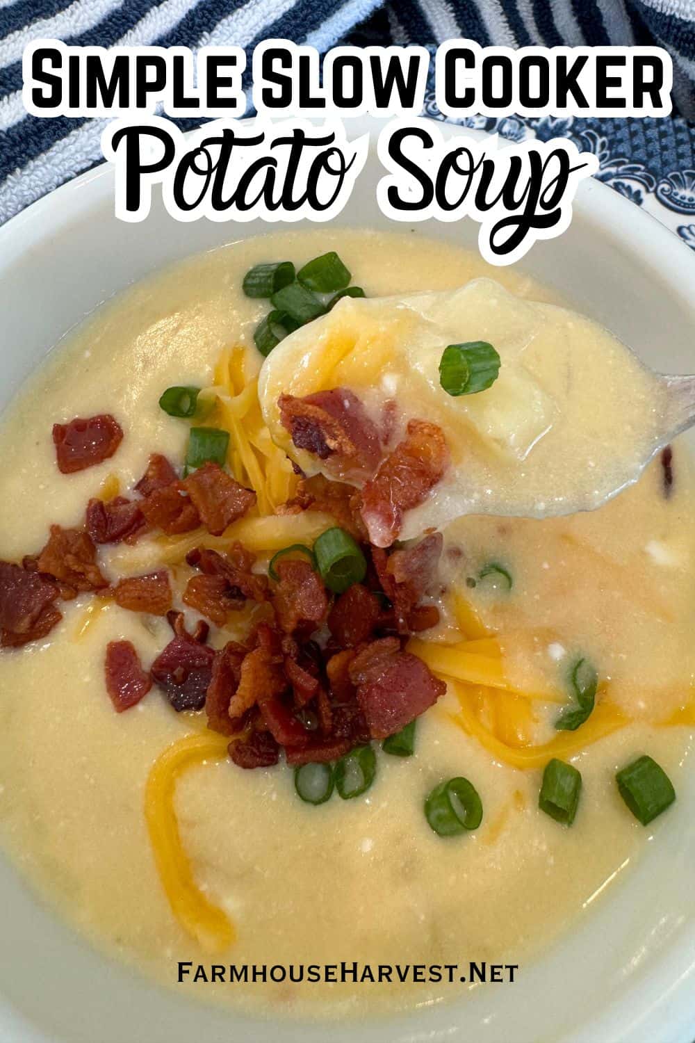 slow Cooker potato soup recipe in bowl with spoonful garnished with bacon, cheese and chives. And text