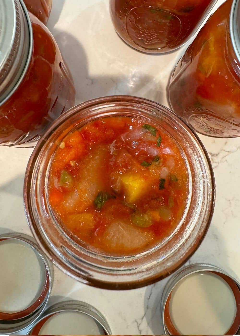 looking into jar of peach and pear salsa