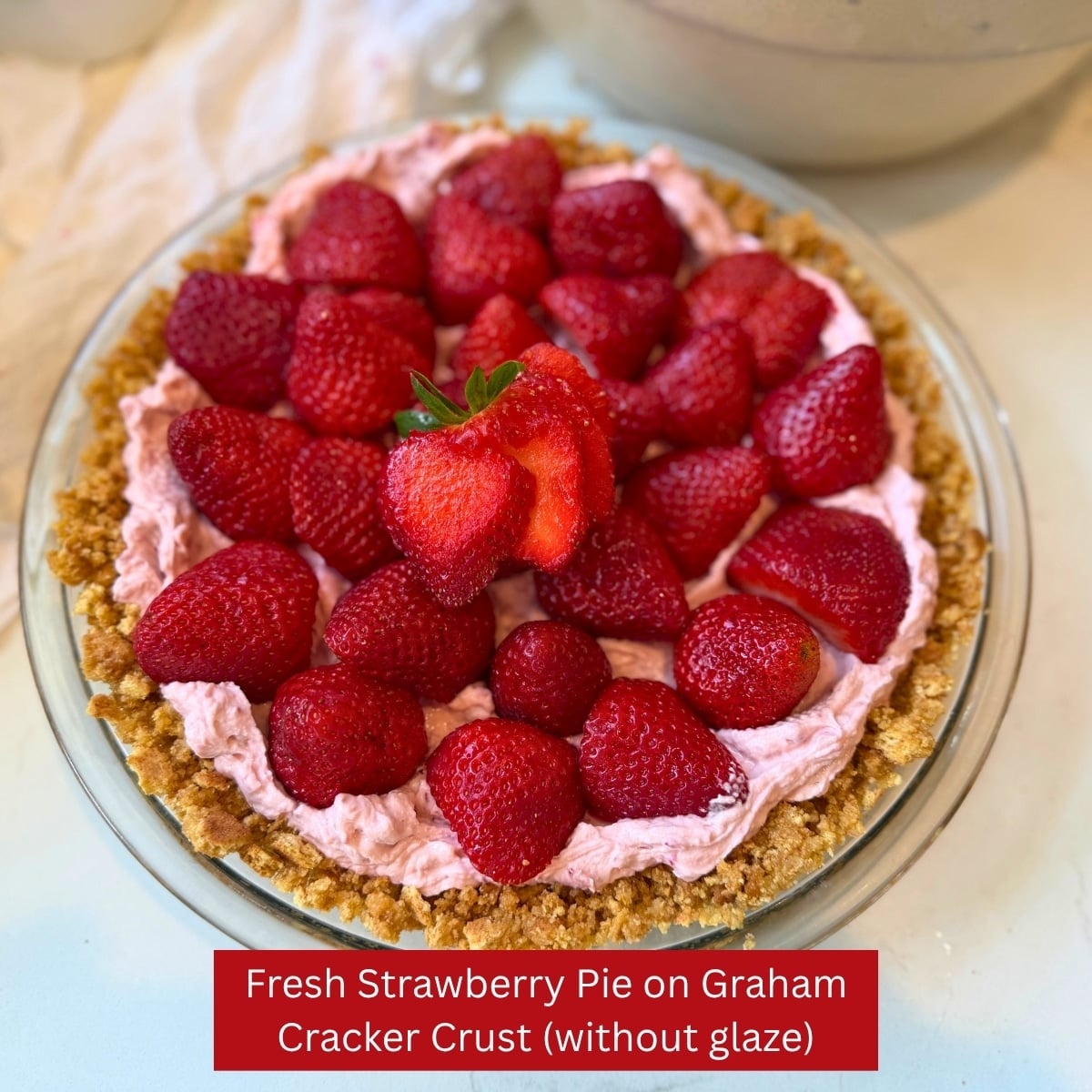 fresh strawberry pie on graham cracker crust without glaze