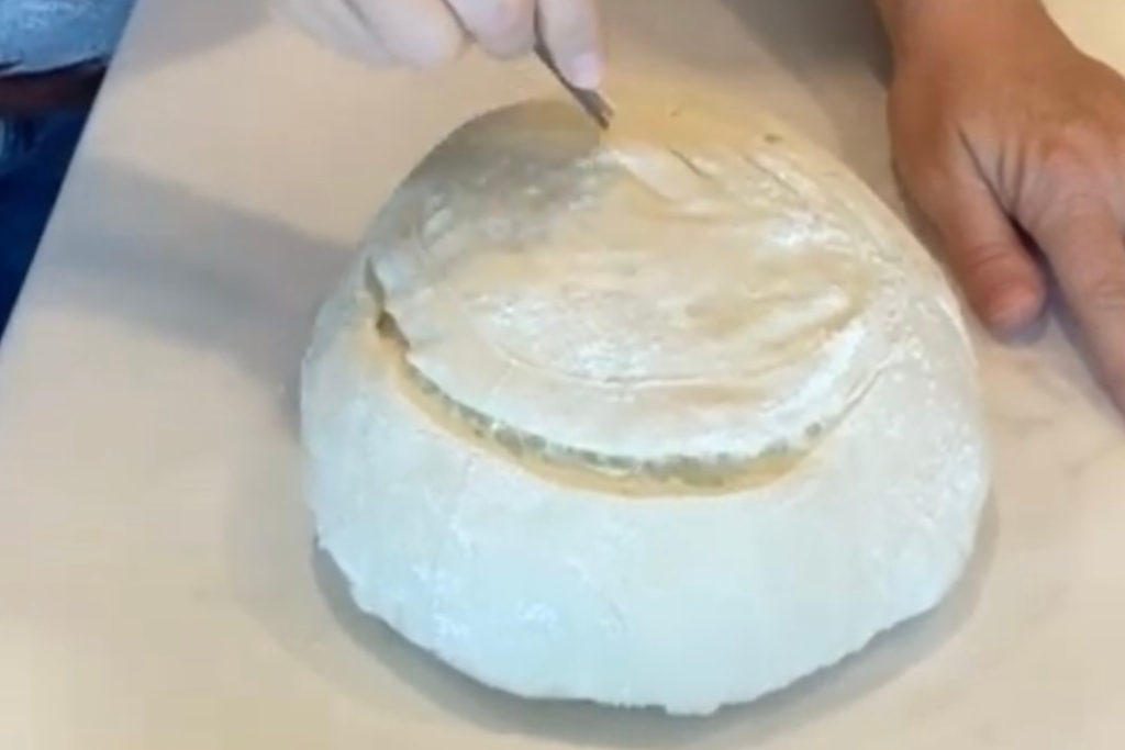 scoring sourdough bread dough