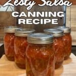 5 pint jars of zest salsa canning recipe on cutting board with text