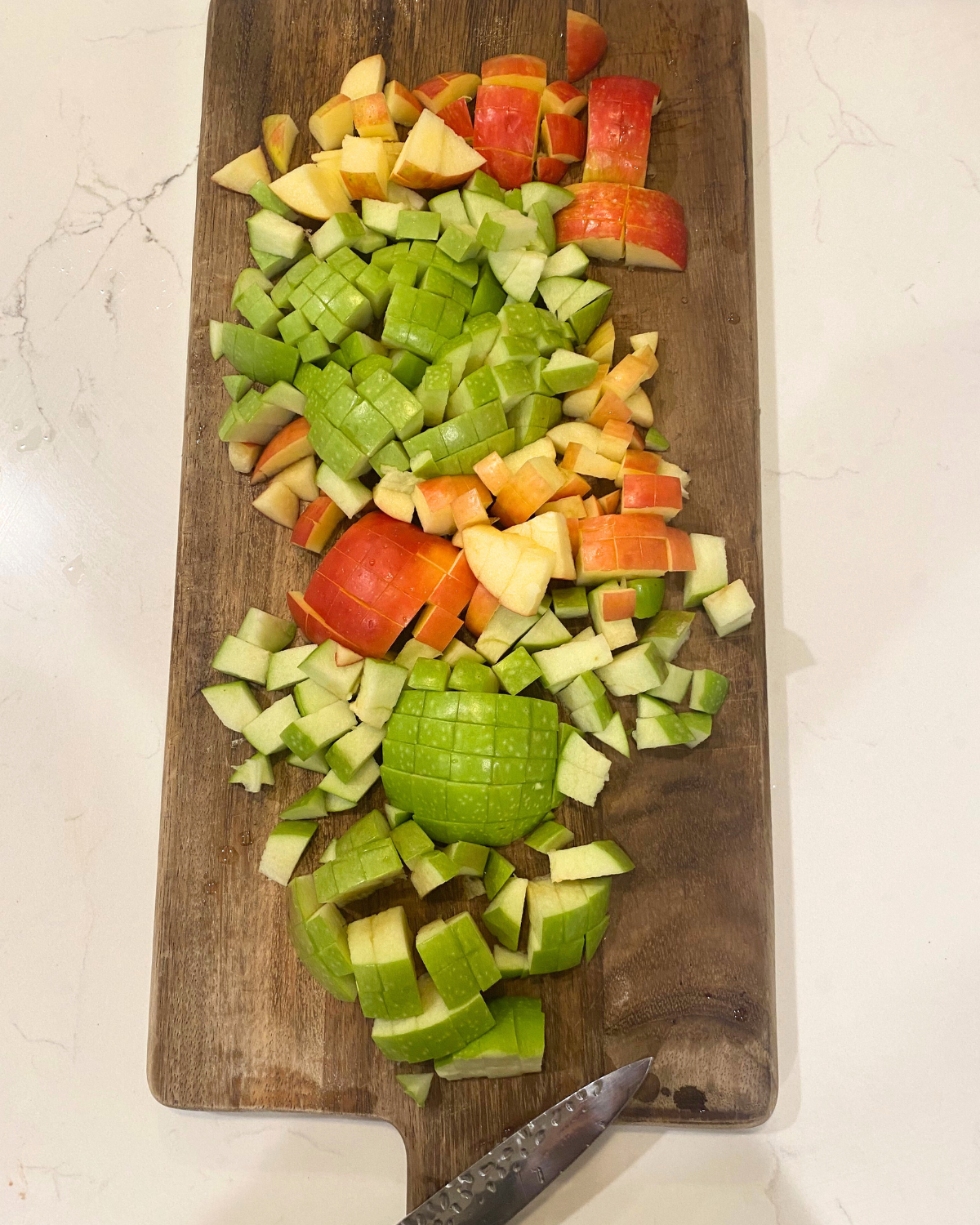 chopped granny smith and honey crisp apples for waldorf apple salad