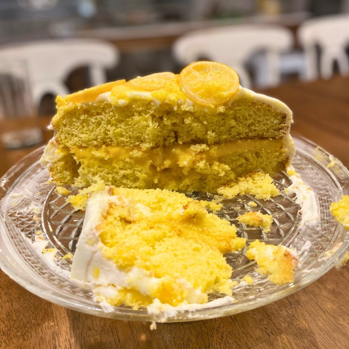 sliced lemon cake with lemon curd filling, lemon butter cream and candied lemons