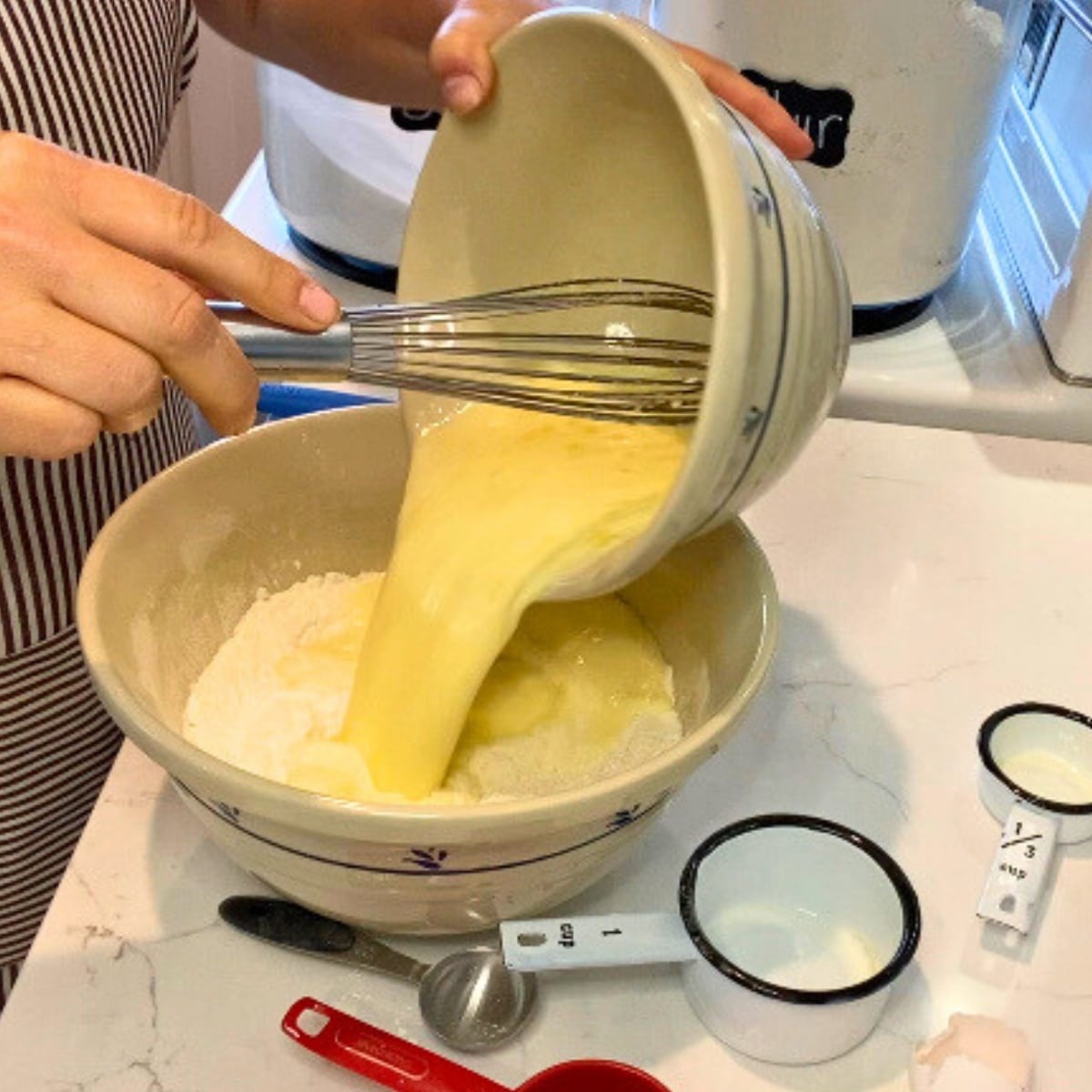 making lemon cake batter in bowl