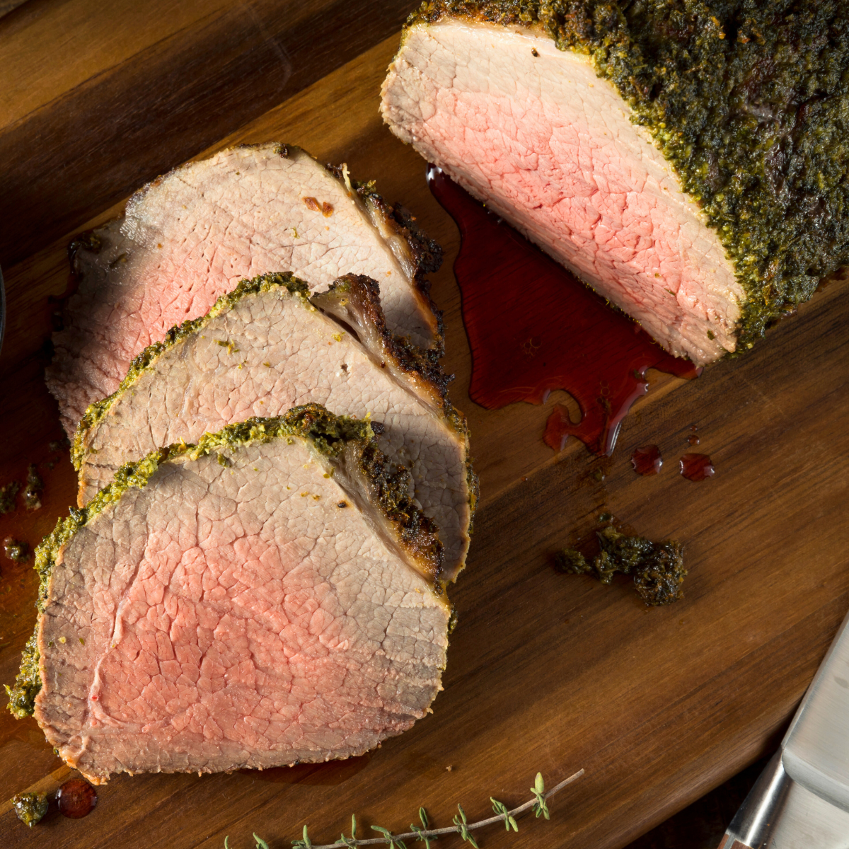 tender roast beef on cutting board sliced 