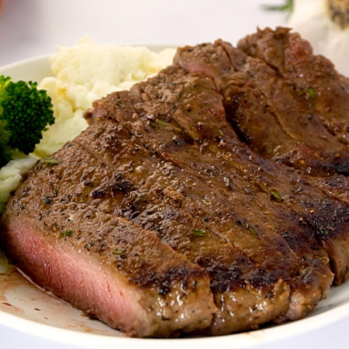 savory sirloin steak sliced on plate