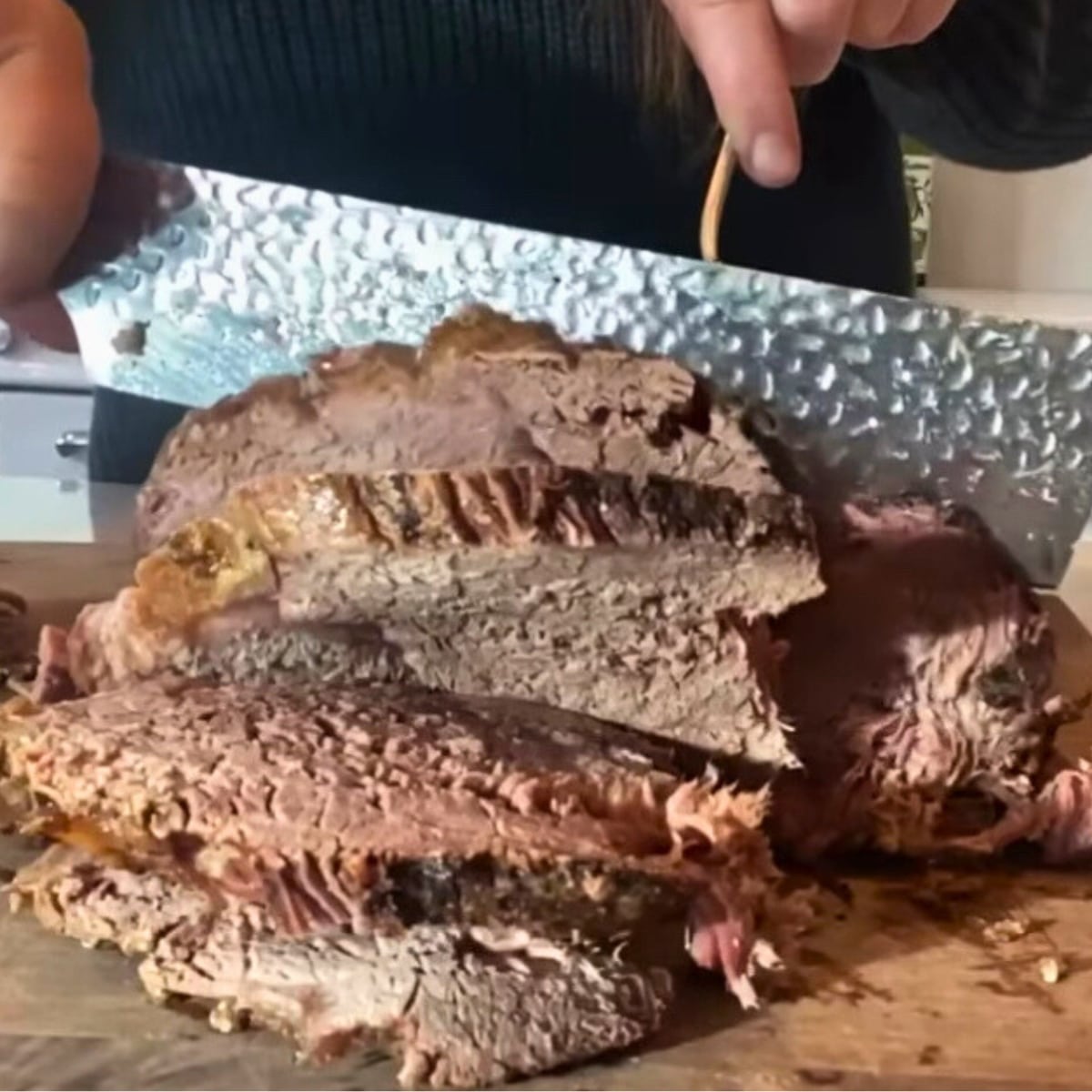 cutting into fall apart sirloin tip roast against the grain