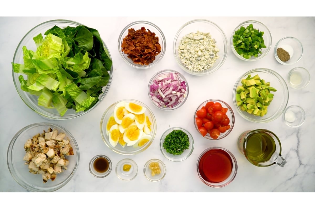 cobb salad ingredients in separate bowls