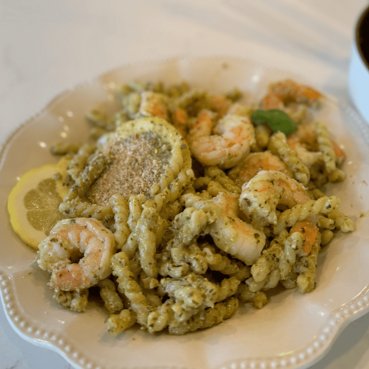 gemelli pasta with lemon pesto and shrimp dish - dinner recipe on plate