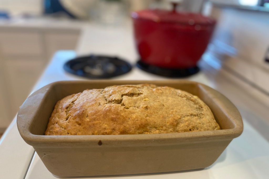 sourdough banana bread loaf in pan on stove