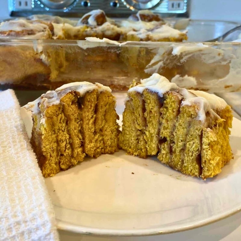 soft sourdough pumpkin cinnamon rolls sliced in half to show inside