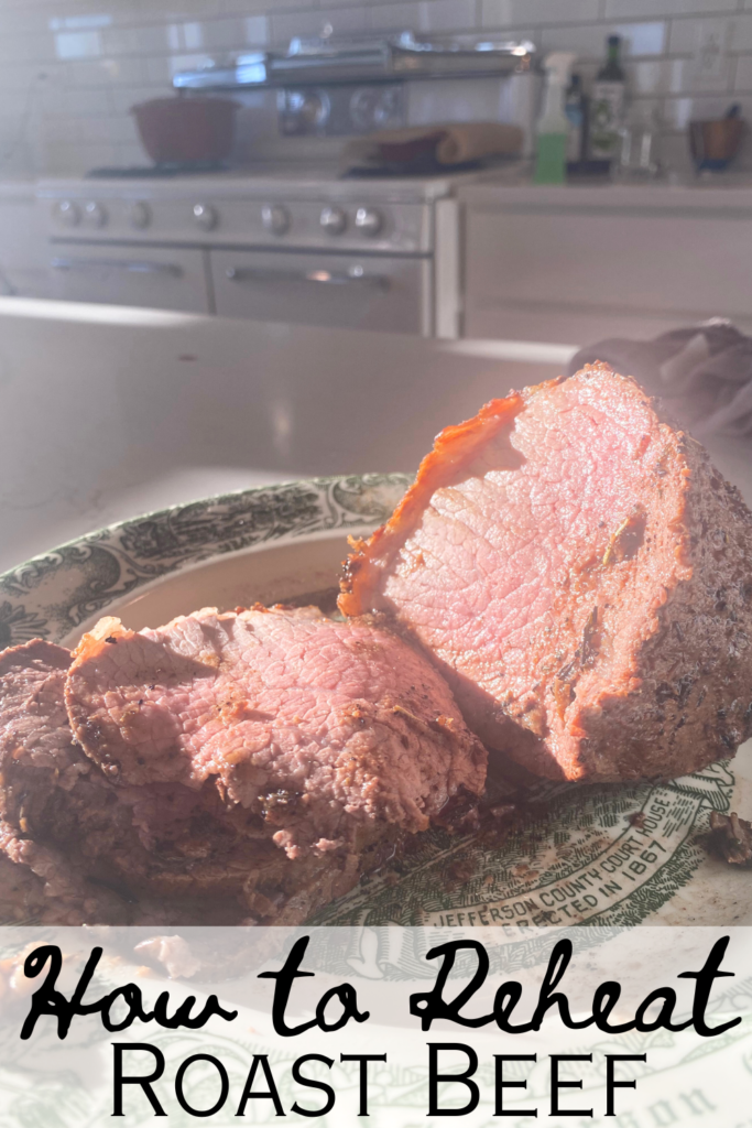 how to reheat roast beef pictured roast beef sliced on plate with text and oven in the back ground