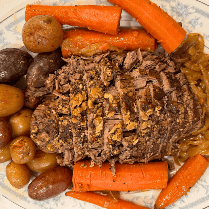 slow cooker rump roast with potatoes carrots and onions on a platter