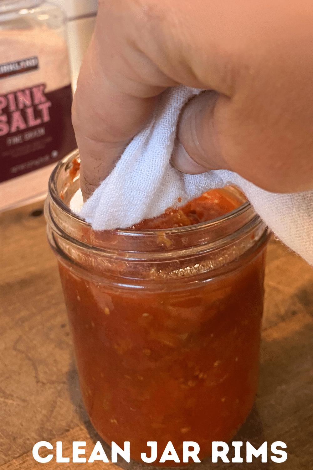wiping rim of jar before adding lid