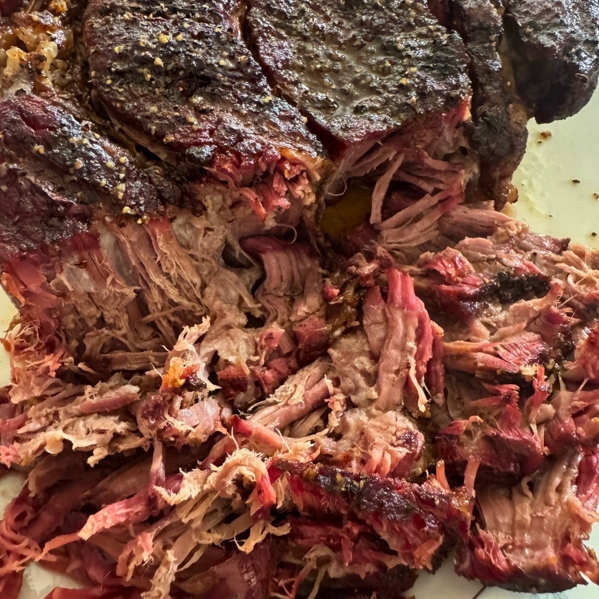smoked beef roast falling apart on platter
