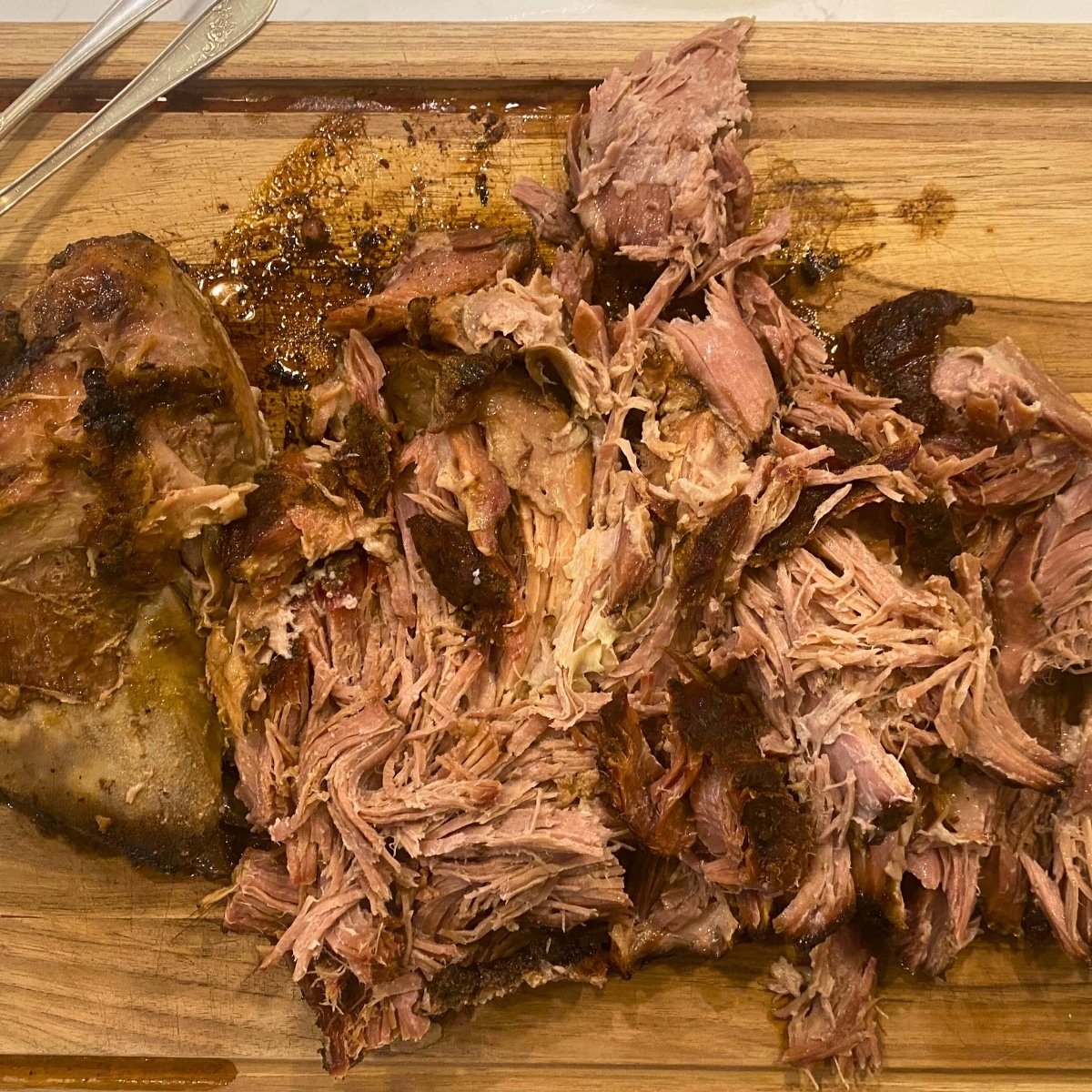 oven roasted pork butt roast on a cutting board. Fall apart tender