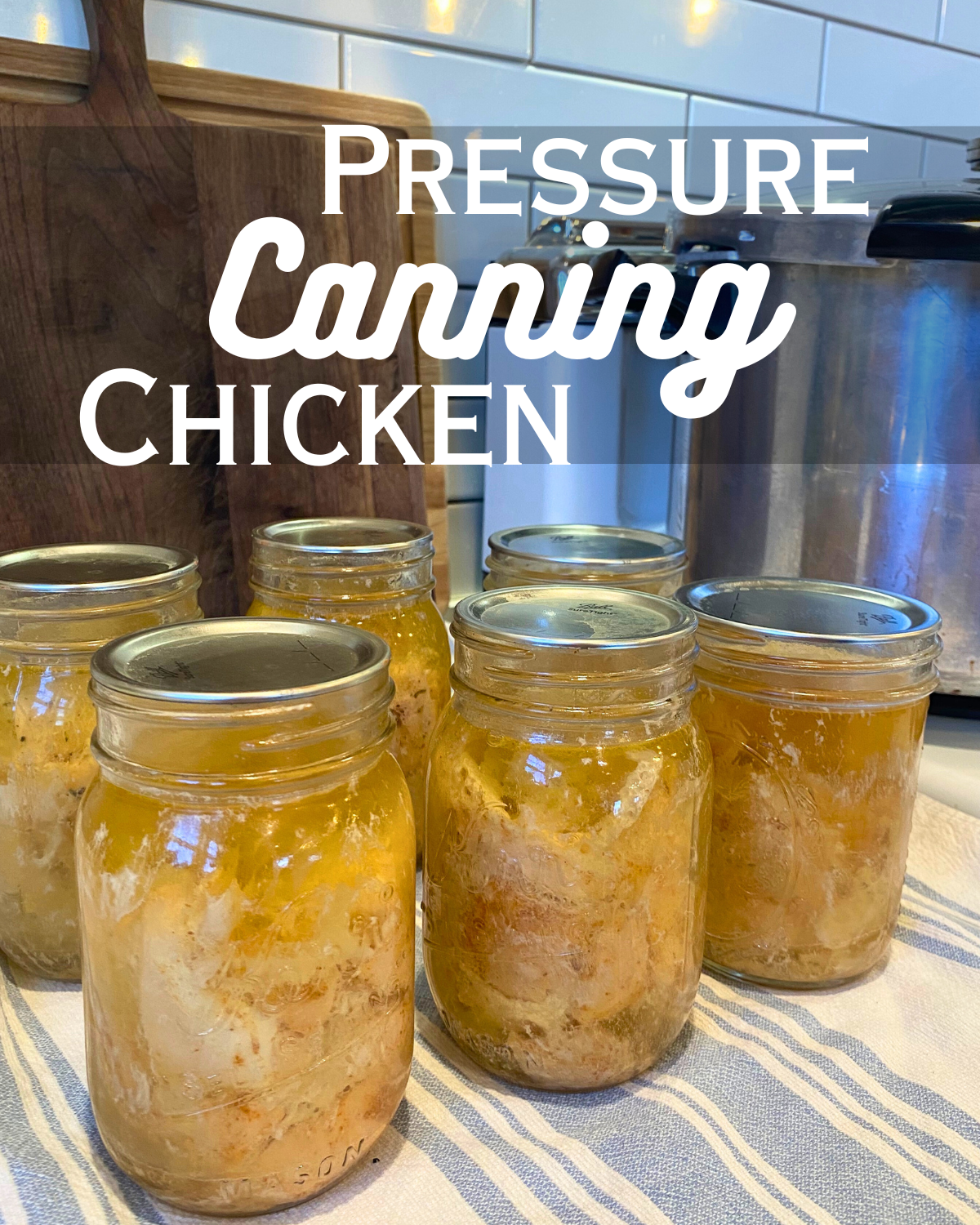 pressure canned chicken in pint jars on counter by the presto pressure canner with text