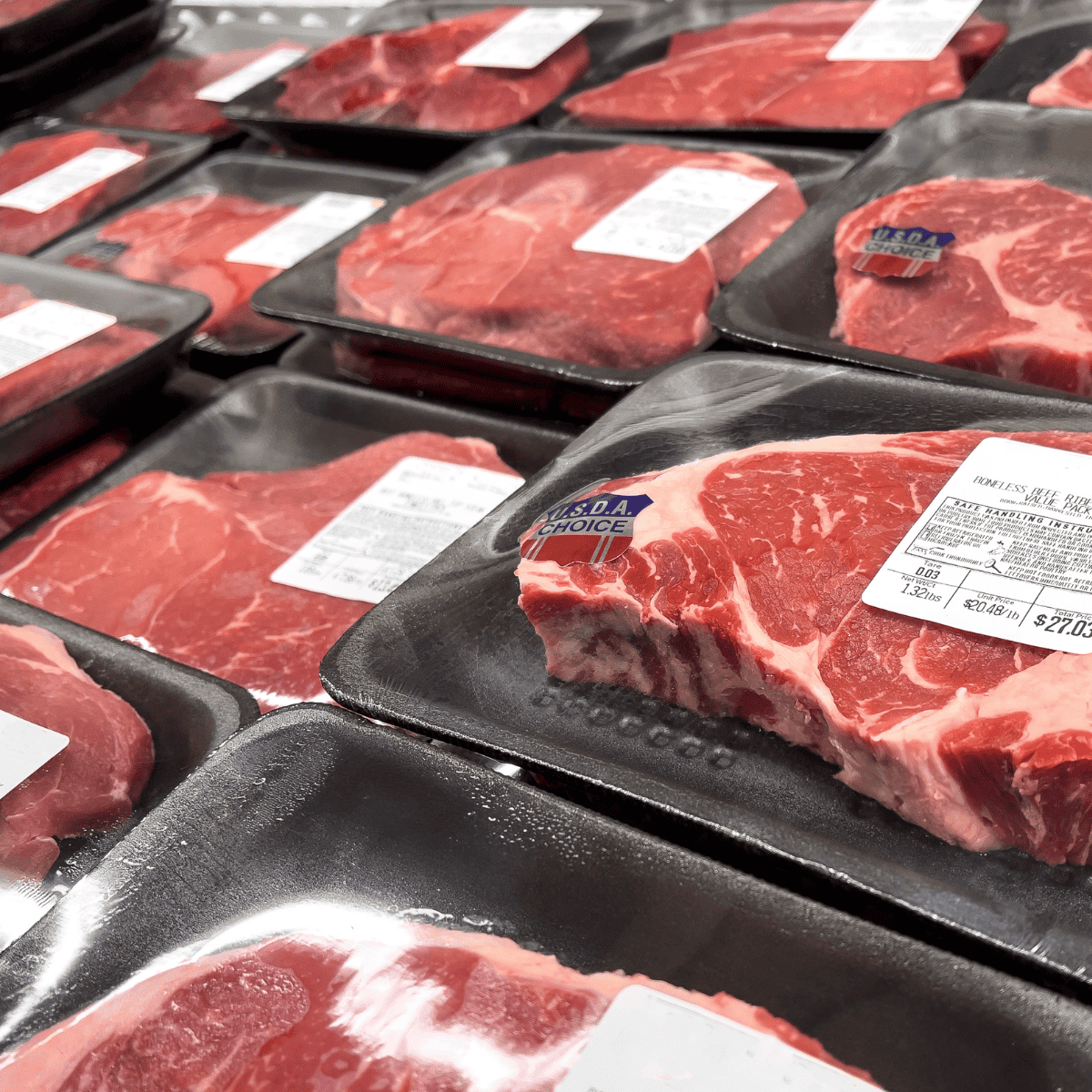 USDA choice steaks at grocery store in packages with USDA stickers