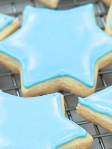 easy sugar cookie icing recipe on star shaped cookies