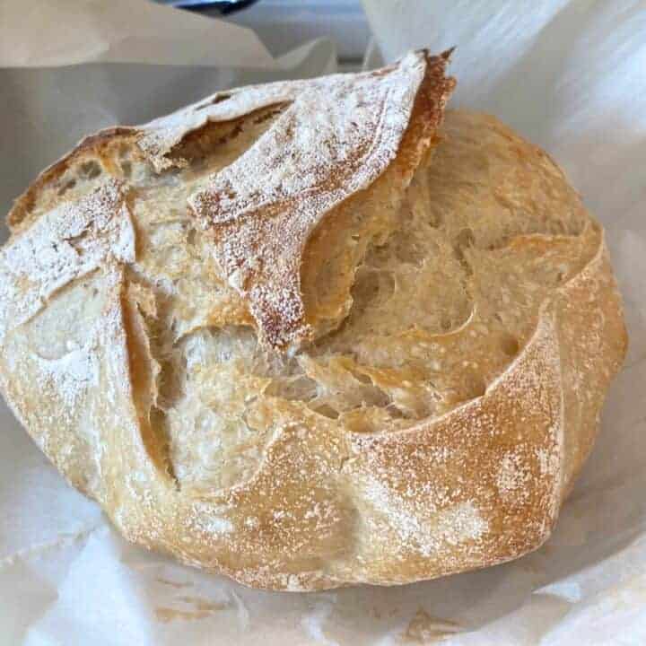 same day sourdough bread loaf on parchment paper