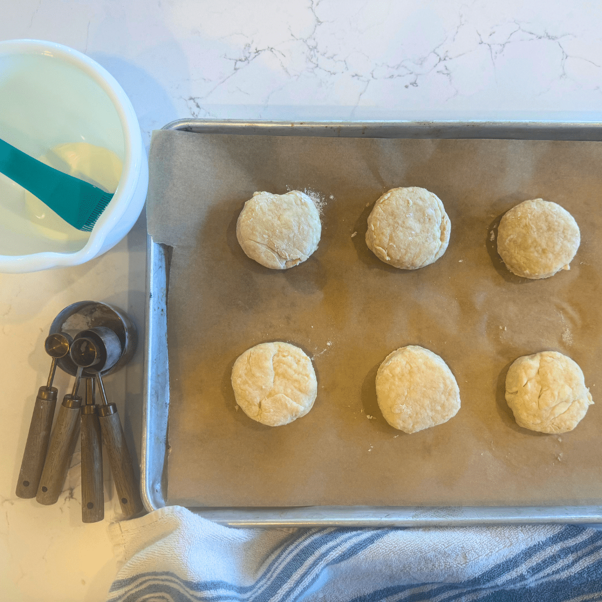 flakey sourdough biscuits dough o baking sheet