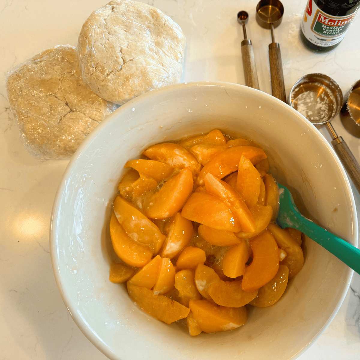 peach pie filling in mixing bowl