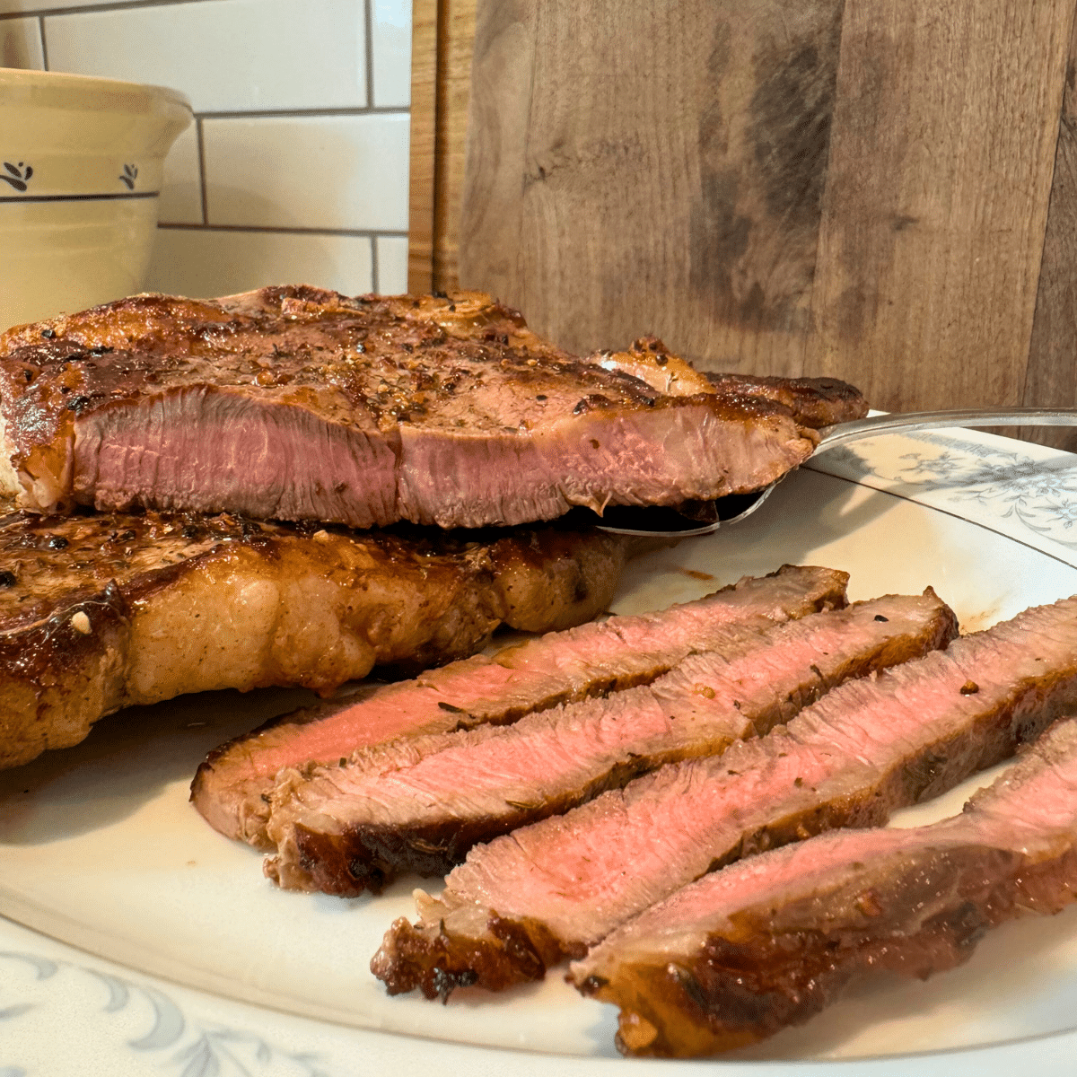 traditionandthyme.com t-bone steak recipe sliced on platter