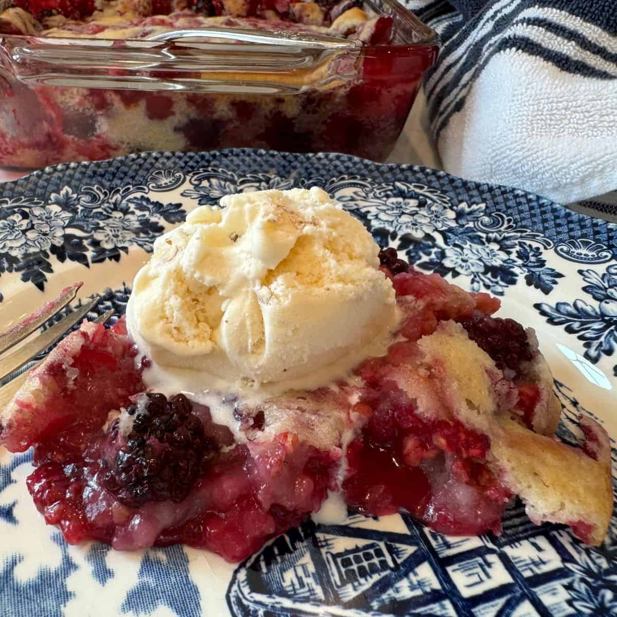 blackberry cobbler with ice cream ontop