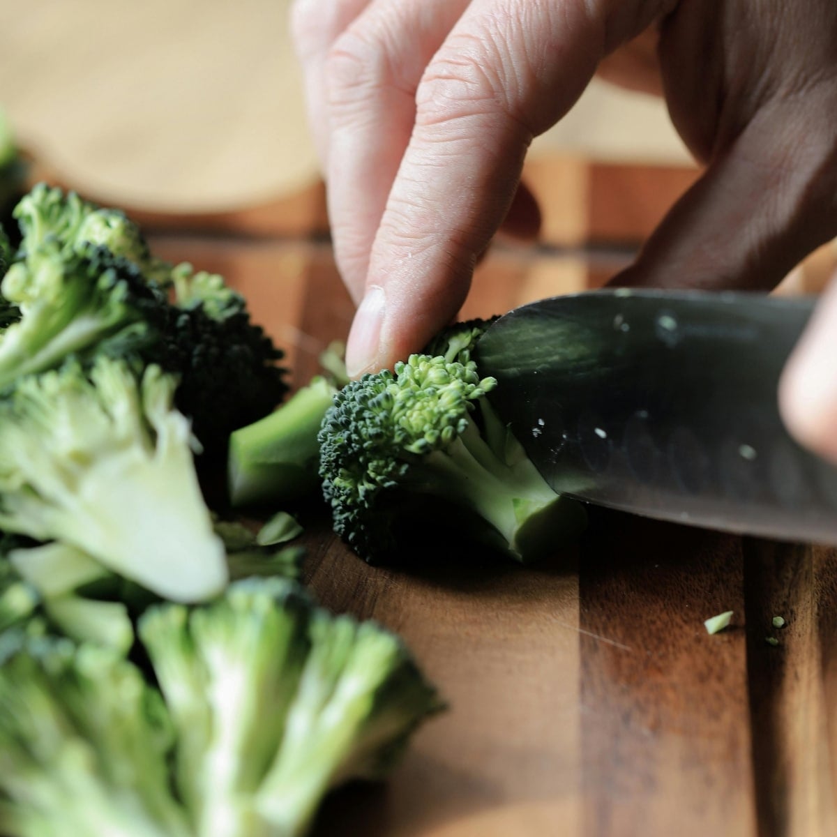 choipping broccoli salad on a cutting board