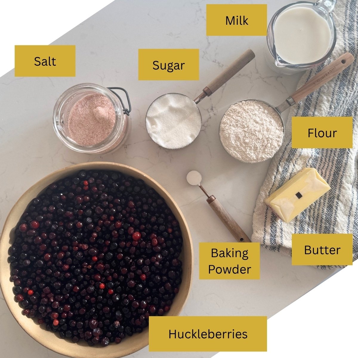 ingredients for huckleberry cobbler huckleberries, butter, flour, sugar, baking powder, milk, and salt