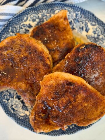 pan seared pork chops on a blue plate