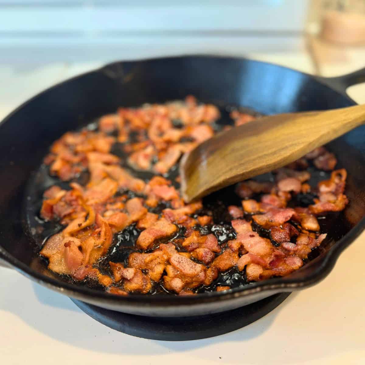 cook bacon in cast iron skillet over medium high heat until crisp