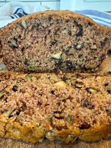 showing texture and crumb inside moist sourdough zucchini bread loaf, sliced