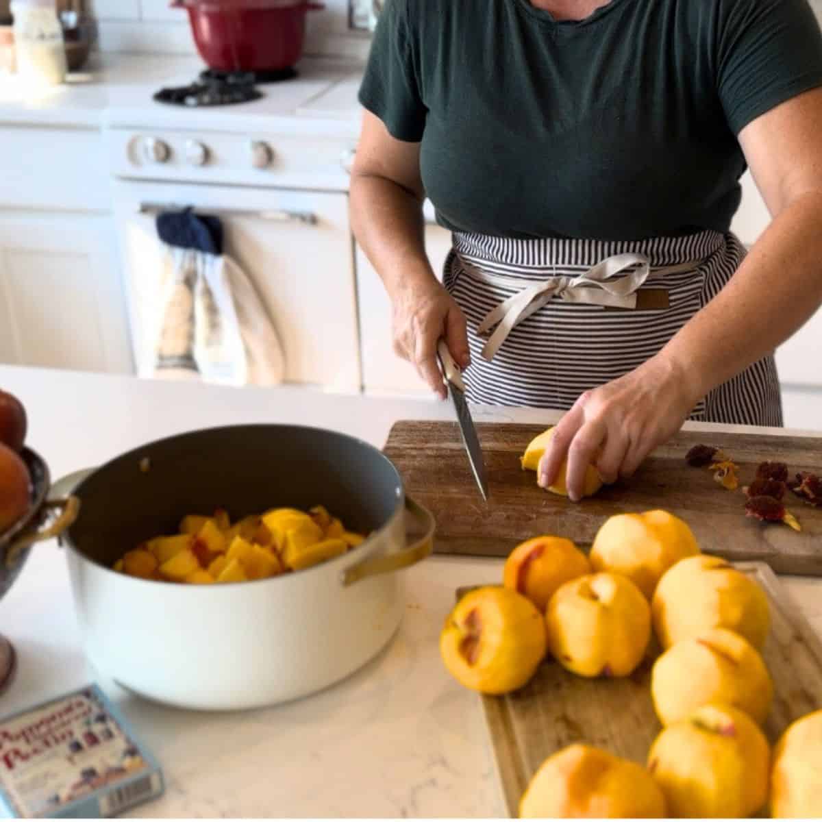 preparing peaches, slicing and placing in pot