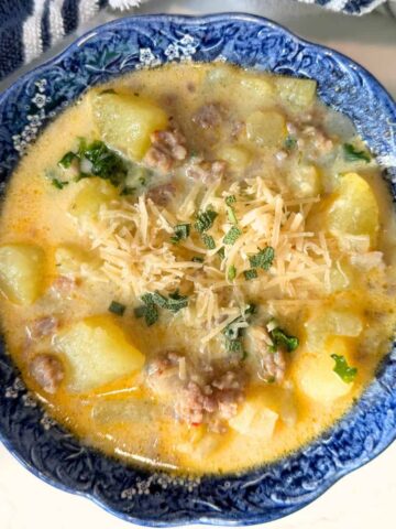 a blue bowl of quick and easy zuppa Toscana