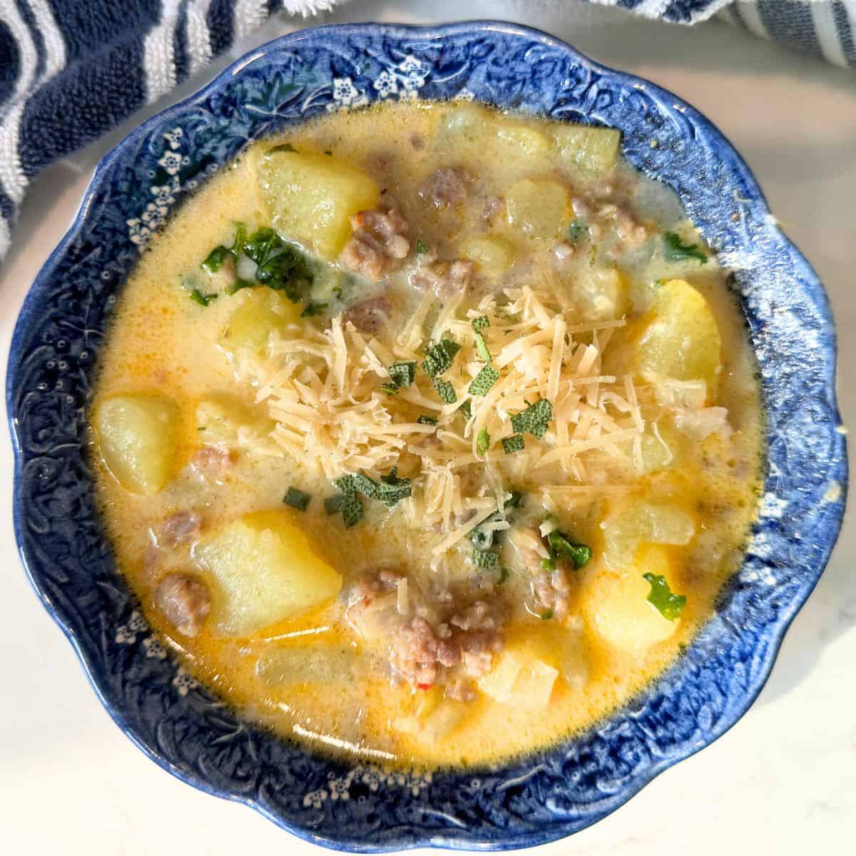 a blue bowl of quick and easy zuppa Toscana