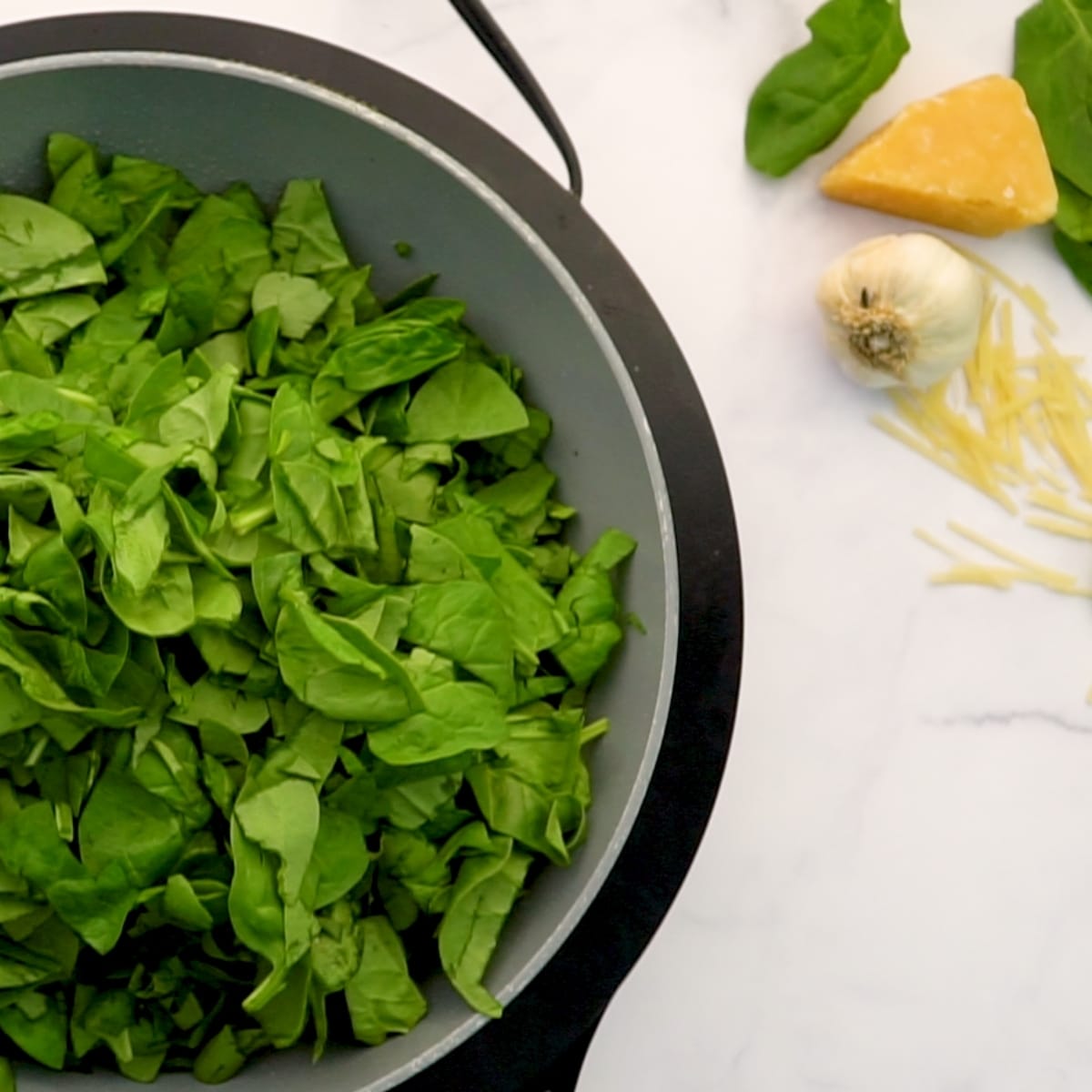wilting spinach in pan