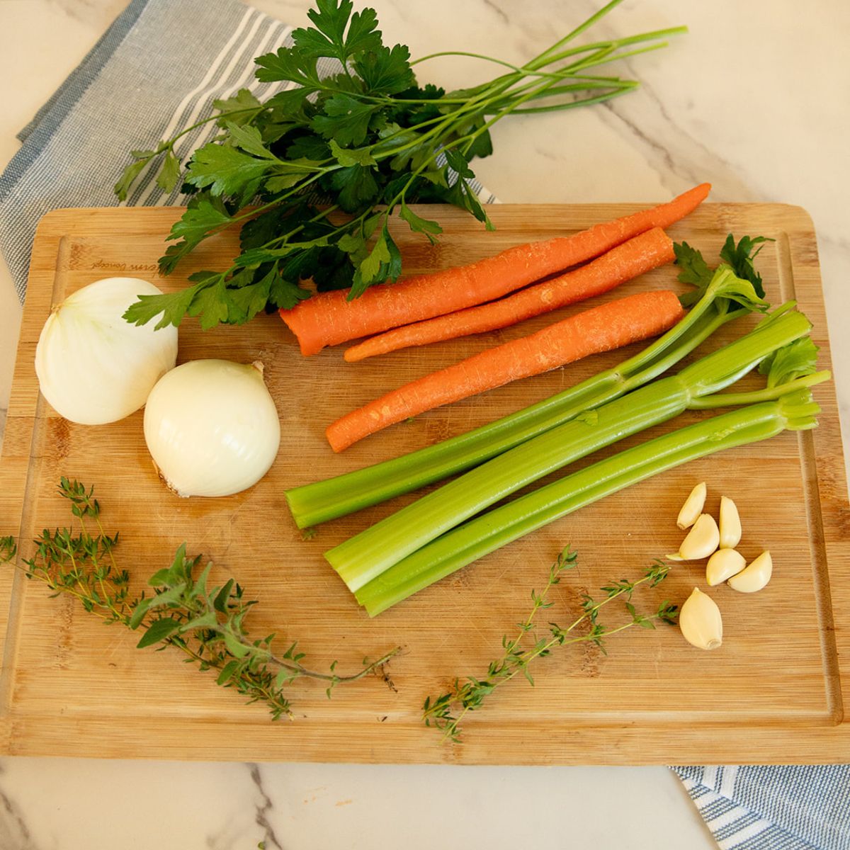 creamy chicken noodle soup recipe ingredients Chicken breast, onion, garlic, celery, carrots, broth, salt and pepper, thyme, bay leaves, parsley, egg noodles and cream