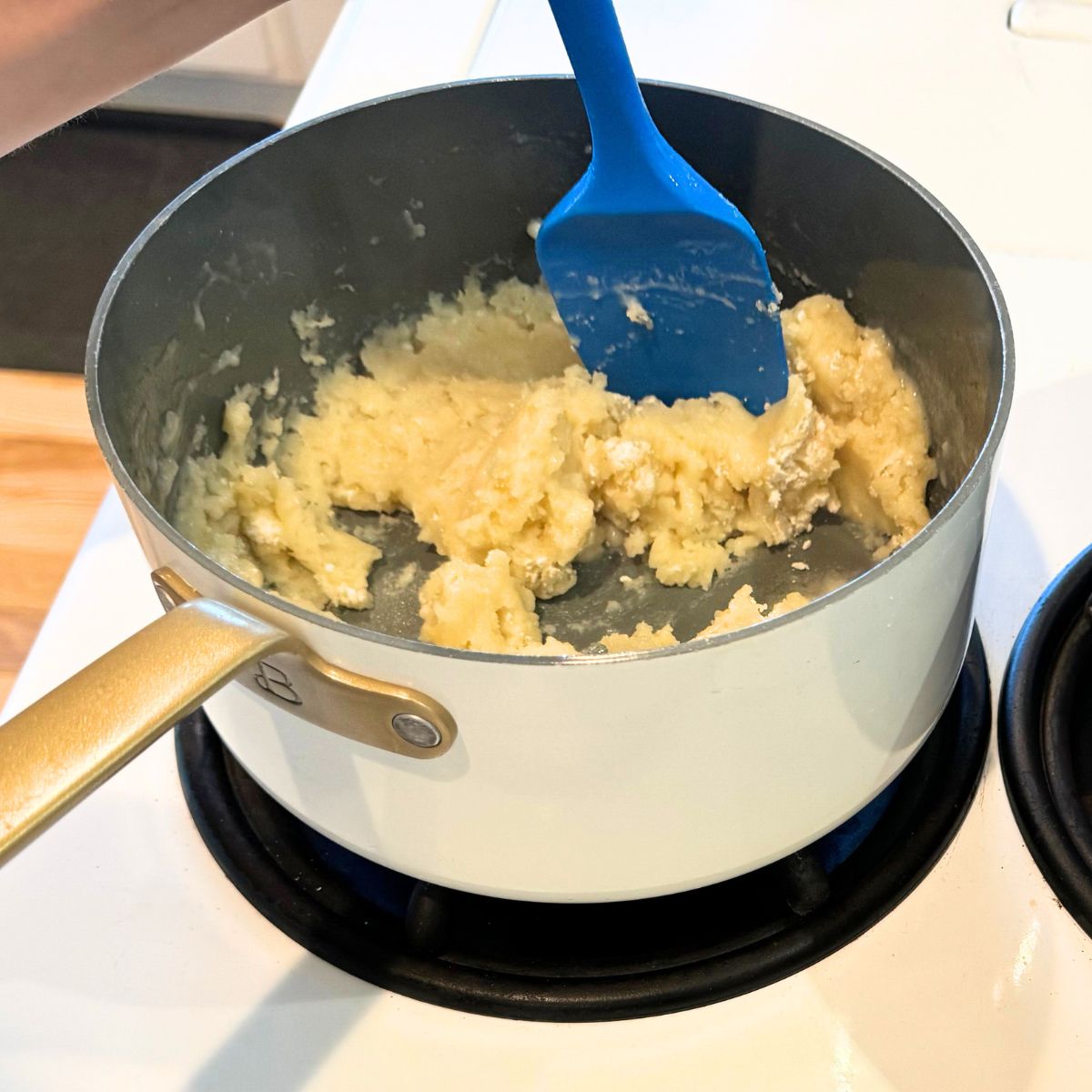 stir flour into butter mixture over low heat till a ball forms