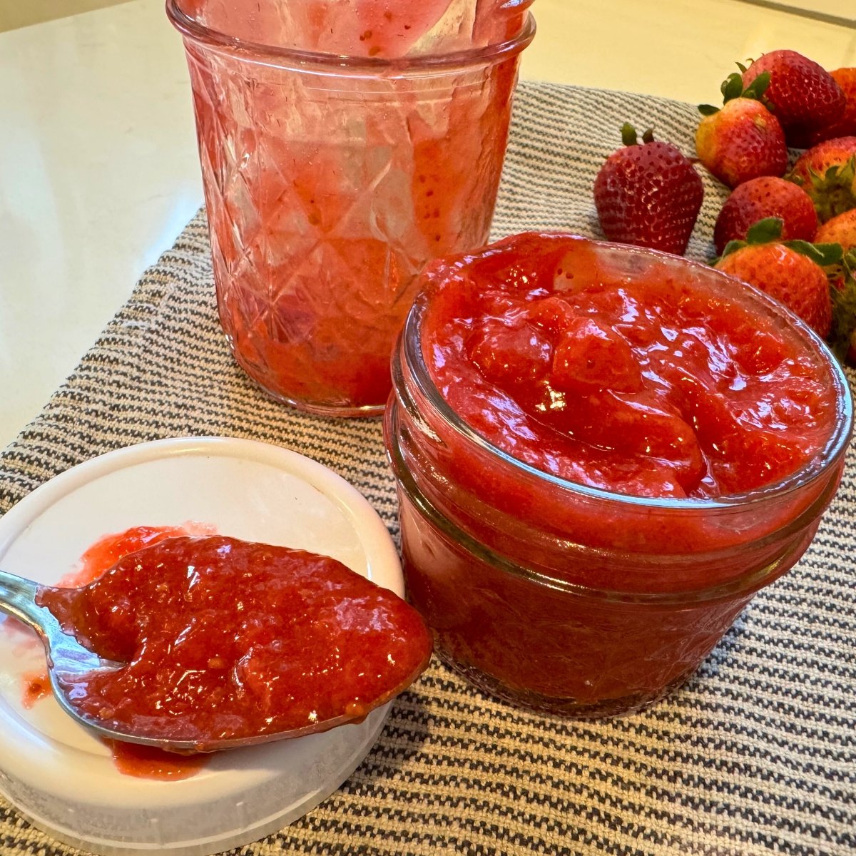 sugar free strawberry freezer jam in jar and on spoon