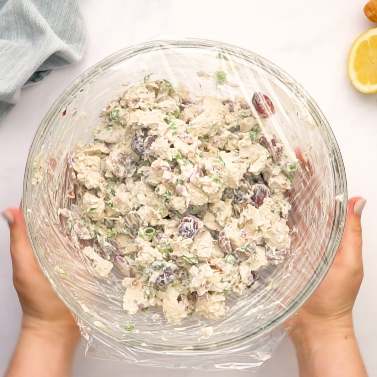 inspant pot chicken salad mixed in serving bowl and covered with plastic wrap to go into the fridge.