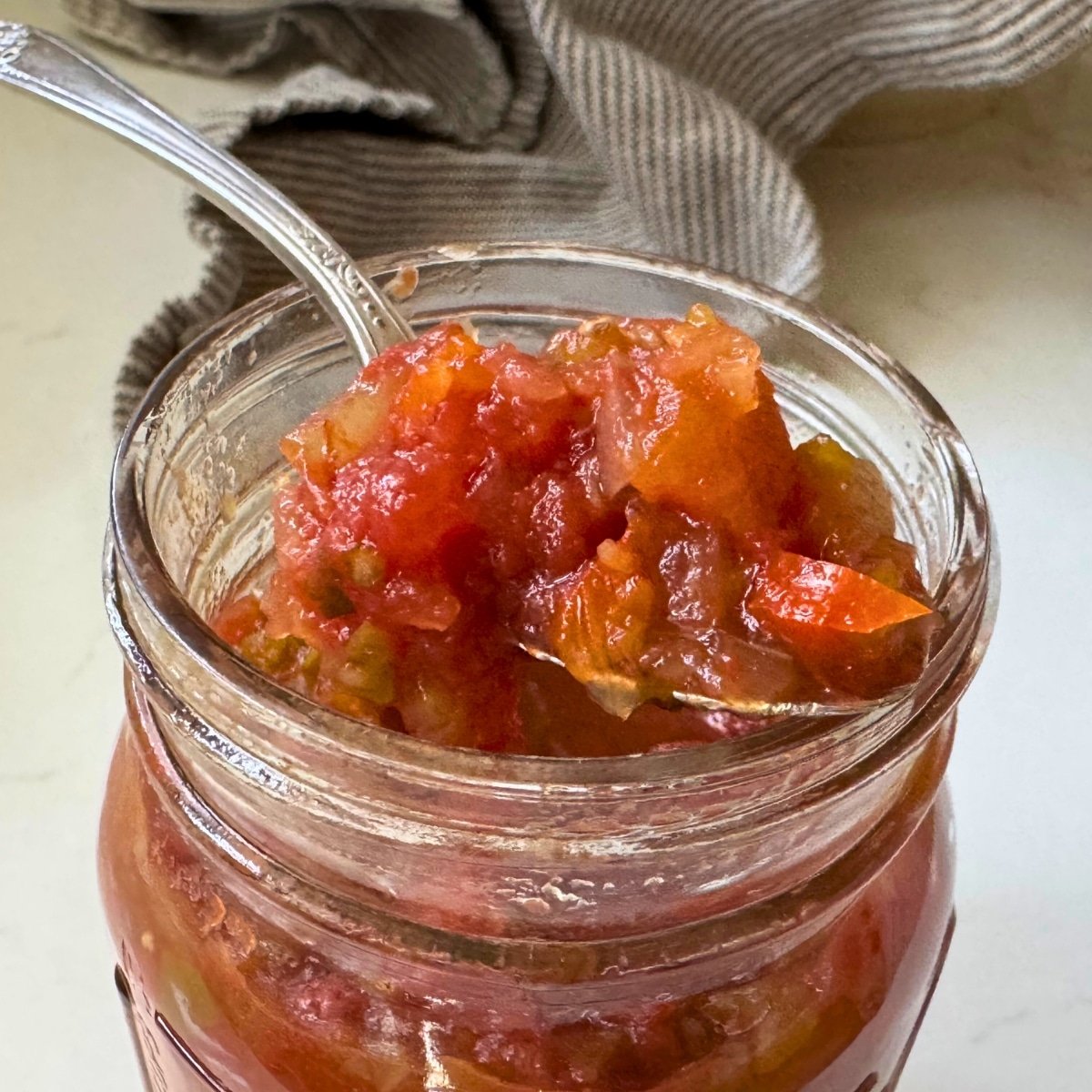 home canned Chunky Salsa, after canning opened jar a year later and this is what it looks like on a spoon.... delicious!