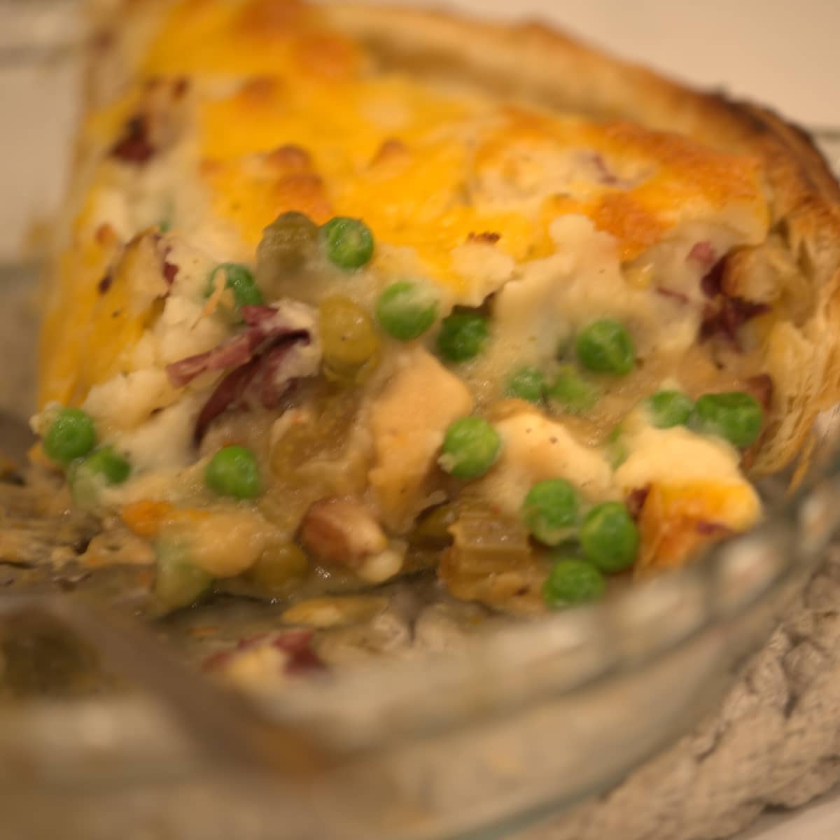 chicken pot pie filling canning recipe made into a chicken pot pie with potato and cheese topping