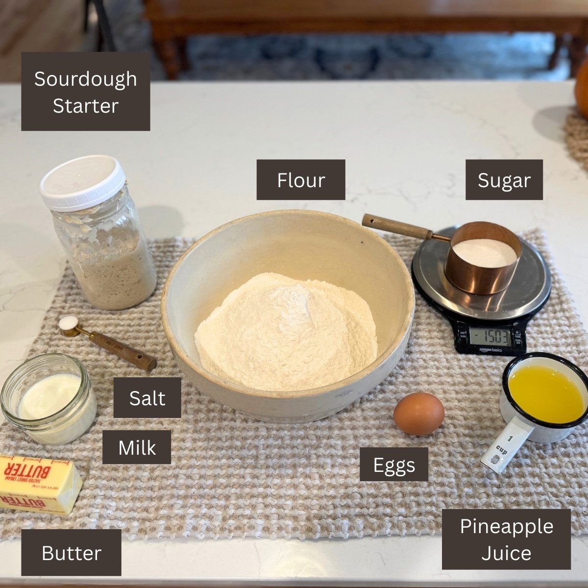flour, butter, pineapple juice, salt, sugar, butter egg labeled on counter