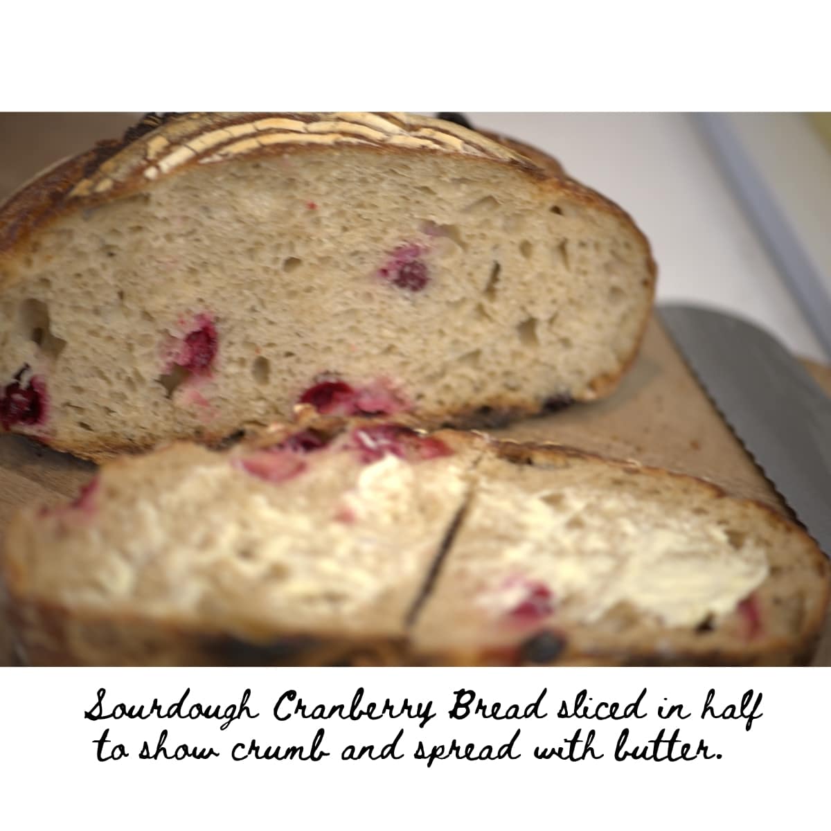Sourdough Cranberry Bread sliced with butter and text