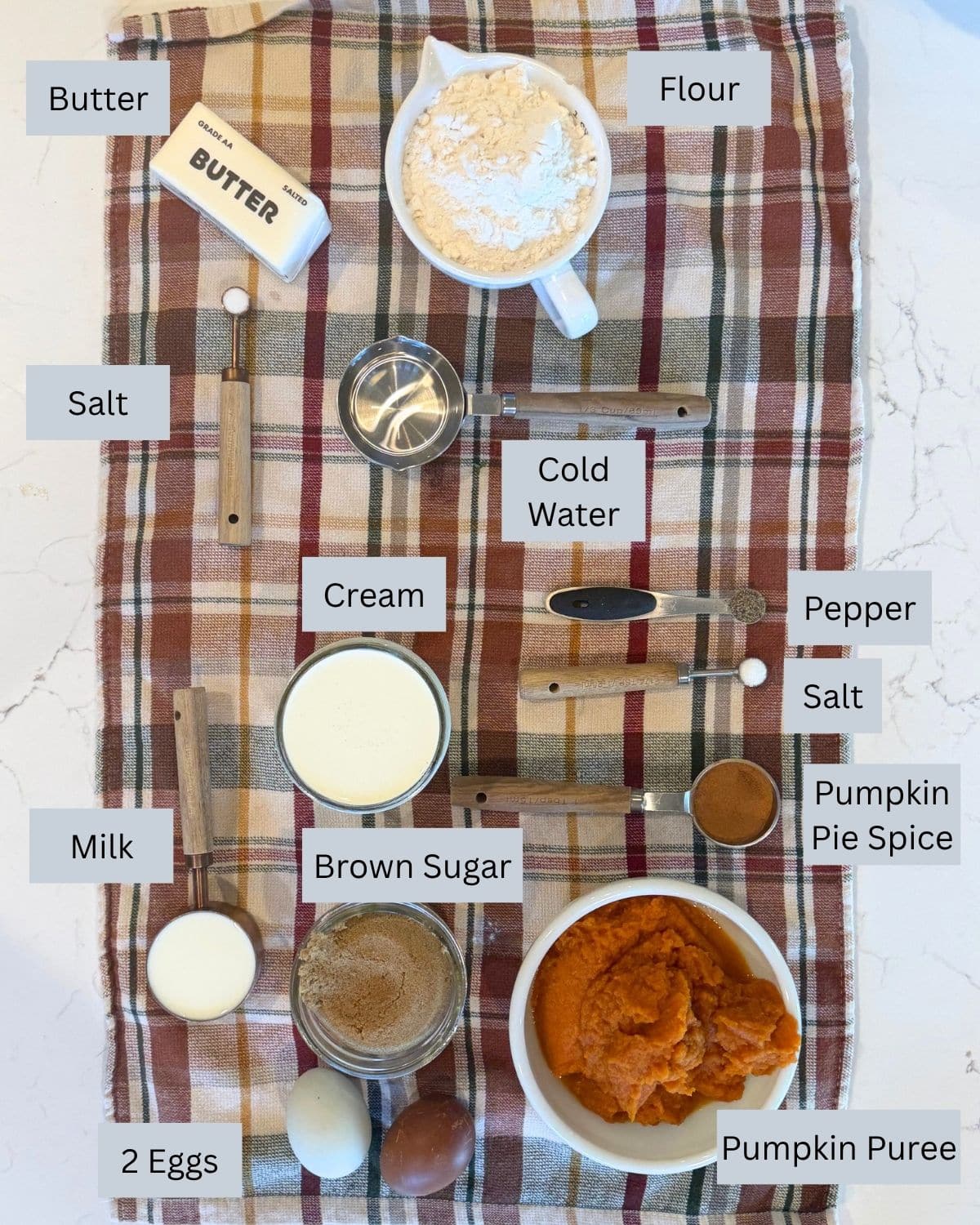 easy pumpkin pie ingredines: for the crust: flour, butter, water, salt. For the filling: Pumpkin puree, cream, milk, eggs, pumpkin pie spice, pepper and salt