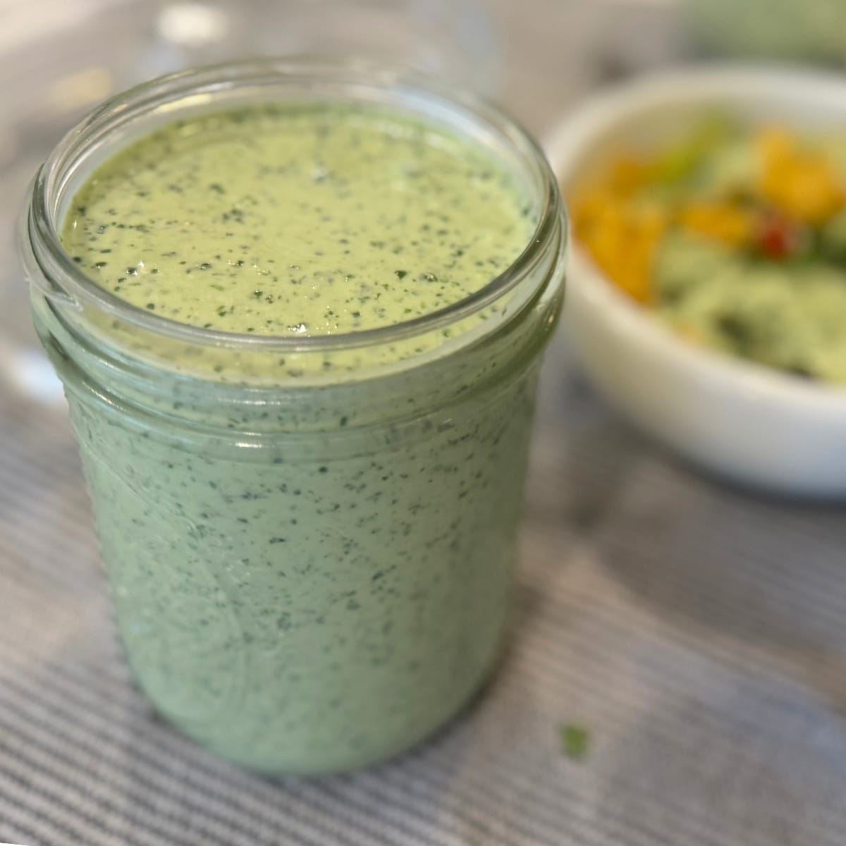 Creamy Tomatillo cilantro lime ranch dressing in a mason jar