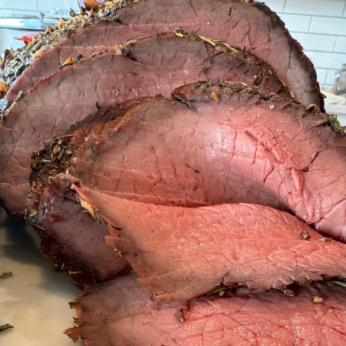 oven seared top round roast sliced up close